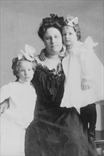 Mrs. Crabbe with two girls, between c1890 and 1910.