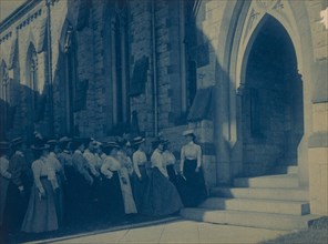 Group of young women at entrance of church, (1899?).