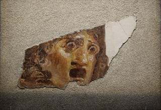 Fragment with tragic theatrical mask, 1st century. Creator: Roman-Pompeian wall painting.