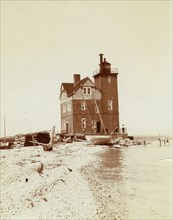 View of lighthouse from beach, Duluth, Minn., 1903.