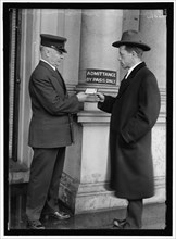 Examining pass at State Department Building, between 1913 and 1918. Creator: Harris & Ewing.