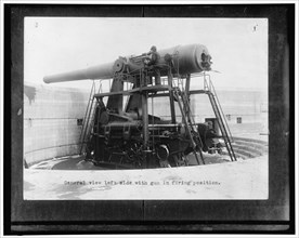 General view left side with gun in firing position, between 1910 and 1920.