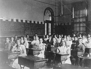 Girls and boys seated at desks in Washington, D.C. classroom, (1899?).