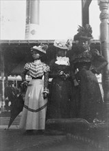 Three African American women, full-length portrait, standing, at the State Fair at Saint Paul, Minn., 1903.