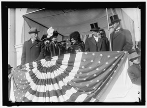 Woodrow Wilson and wife Ellen with unidentified on viewing stand, between 1910 and 1914.