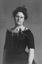 Mrs. Crabbe, half-length portrait, standing, facing front, between c1890 and 1910.
