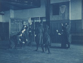 Female students playing basketball, Western High School, Washington, D.C., (1899?).