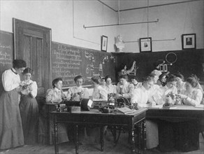 Group of young women studying electro-magnets in normal school, Washington, D.C., (1899?).
