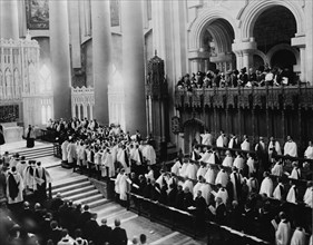 Consecration of the choir and the two chapels of the Cathedral of St. John the Divine, c1911. People standing in church.
