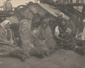 Group of emigrants (women and children) from eastern Europe on deck of the S.S. Amsterdam, 1899.
