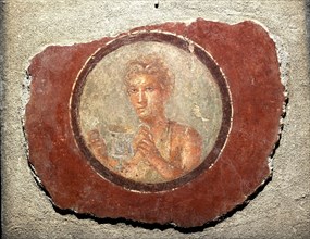 Medallion with a male figure holding a kantharos, 1st century. Creator: Roman-Pompeian wall painting.