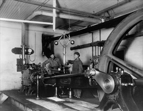 Two young men training in mechanical(?) engineering at Hampton Institute, Hampton, Virginia, 1899 or 1900.