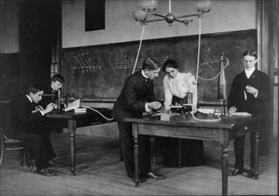 Students in a science class conducting experiments, Western High School, Washington, D.C., (1899?).