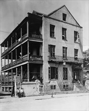 Front and side view of apartment(?) house, 61 Washington Street, Charleston, South Carolina, between 1933 and 1940.