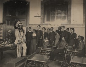 Louis Firetail (Sioux, Crow Creek), wearing tribal clothing, in American history..., 1899 or 1900. Creator: Frances Benjamin Johnston.