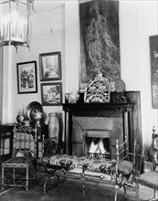 Fireplace, furniture, and works of art in Frances Benjamin Johnston's..., New Orleans, c1920 - 1950. Creator: Frances Benjamin Johnston.