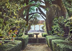 Reproduction of illustration showing a garden fountain, between 1915 and 1925. Creator: Frances Benjamin Johnston.