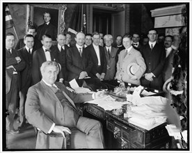 Lindley M. Garrison in office with group, between 1910 and 1920. Creator: Harris & Ewing.