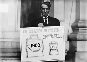 Theron Akin, Rep. from New York; with 'Full Dinner Pail' Placard, 1913. Creator: Harris & Ewing.