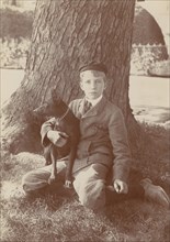 Kermit Roosevelt and Jack, the dog, 1902. Creator: Frances Benjamin Johnston.