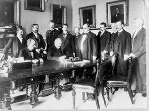 Ambassador Cambon signing the Peace Protocol, c1898. Creator: Frances Benjamin Johnston.