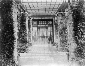 View of pergola, toward door, to home of Edmund Cogswell Converse, Greenwich, Connecticut, 1908. Creator: Frances Benjamin Johnston.
