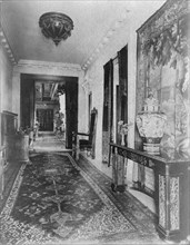 Hallway, with Oriental urn at right, in home of Edmund Cogswell... Greenwich, Connecticut, 1908. Creator: Frances Benjamin Johnston.