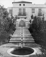 Pasadena, California, Mrs. Herbert Coppell home - pond at foot of long stairway leading..., 1917. Creator: Frances Benjamin Johnston.