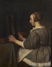 Woman in the mirror, c.1662.