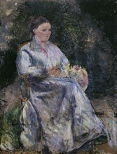 Julie Pissarro au jardin, c.1874. Creator: Camille Pissarro.
