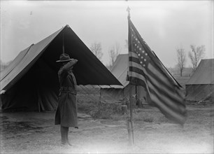 Army, U.S. Negro Troops, 1917. [African American soldier saluting the flag].