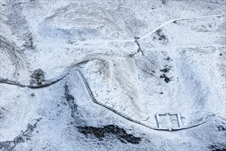 Milecastle 39 and Sycamore Gap Tree on Hadrian's Wall in the snow, Northumberland, 2018.