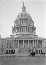 U.S. Capitol - Cleaning Exterior, 1913. Machinery in foreground, hose connected to water main.
