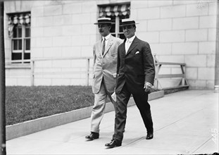 Clarence Funk Leaving S.O.B., [Washington, DC], 1911. [Two men outside the Senate Office Building].
