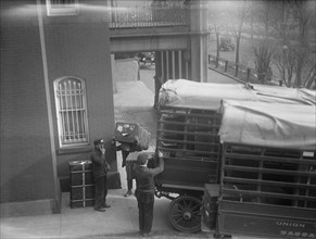 Belongings of Count J.H. Von Bernstorff being removed from the German Embassy, Washington DC, 1917.  Creator: Harris & Ewing.