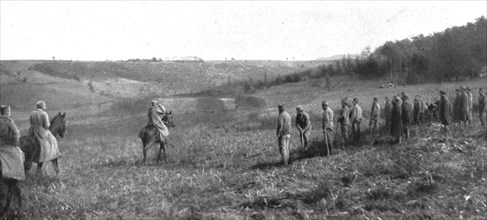 'Le roi Pierre de Serbie, sur le front Nord, visitant ses soldsts qui travaillaient a des..., 1915. Creator: R. Marianovitch.