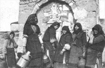 ''Impressions Macedoniennes; Femmes tziganes a la fontaine dans un village grec.', 1915. Creator: Unknown.