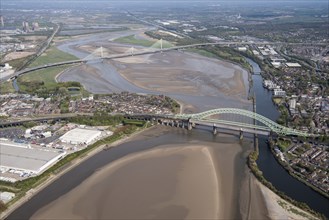 Road and rail bridges over the River Mersey and Manchester Ship Canal at Runcorn Gap, Halton, 2021.