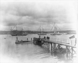 New York - Oyster Bay, Long Island Yacht Club: looking past pier to sailing yachts at anchor, 1905.