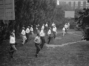 Camp, Walter, I.E, Exercise School - Cabinet Officials Exercising with Other Govt. Officials, 1917 or 1918.