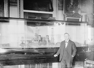 Daniels, Josephus, Secretary of The Navy, 1913-1921. with Model of U.S.S. New York, 1914.
