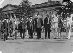 Draft Parade - Senators: Chamberlain; J.H. Bankhead; Knute Nelson; Hardwick; Warren; Lodge..., 1917. Creator: Harris & Ewing.