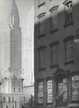 Contrasting No. 331 East 39th Street with the Chrysler building (left) and the Daily News..., 1938. Creator: Berenice Abbott.