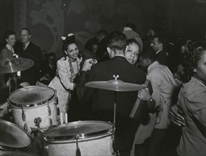 View of crowd dancing to the music of "Red" Sounders and his band, at the Club DeLisa, Chicago, Illinois, April 1942.