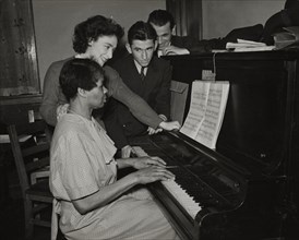 Teacher and student at piano, Jewish Settlement, 1938.