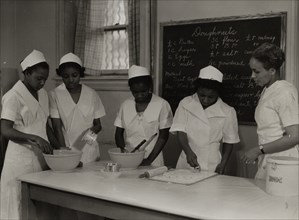Girls instructed in pastry making at Colored Household Training School, 1937.