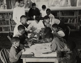 Oliver Harrington supervises class studying mural work, Hudson Ave Boys' Club, 1936.
