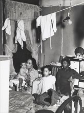 Negro family living in crowded quarters, Chicago, Illinois, April 1941.