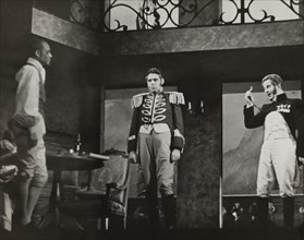 Three men, one with monocle, 1938.