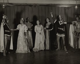 Parker Watkins with raised sword, and others, 1936.